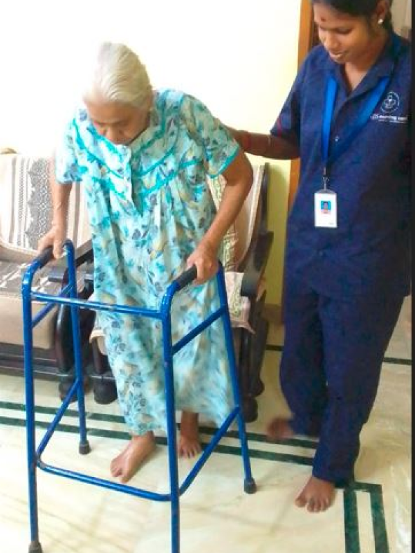 female nurse assisting elder woman
