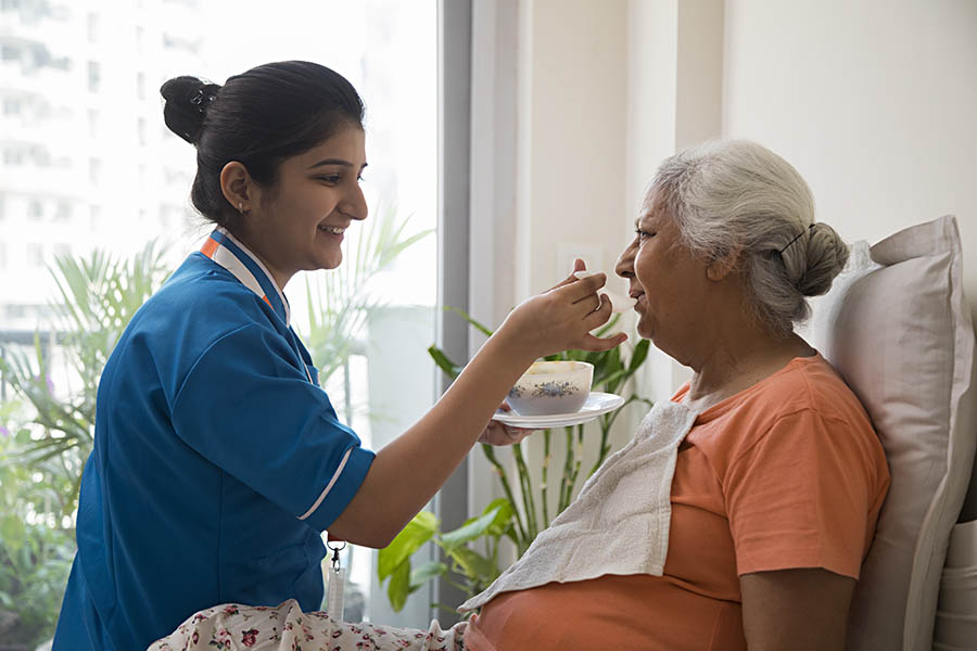 nurse taking care and feeding